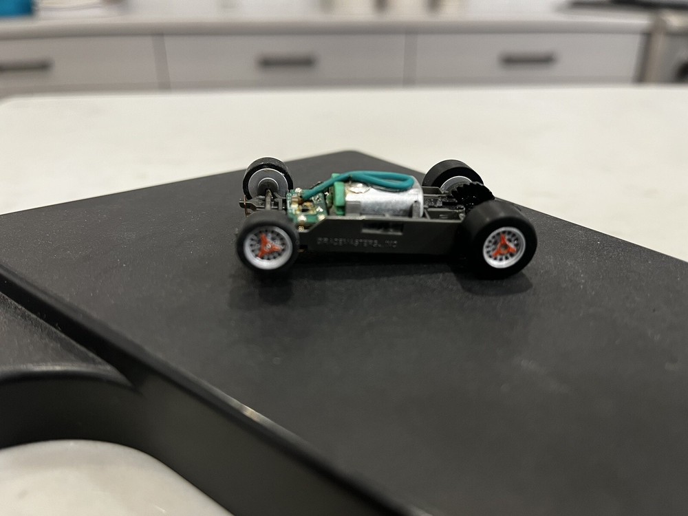 AFX Mega G+ 1.5 Narrow Slot Car Chassis with Silver Rims & Dual Colored Spinners