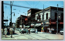Postcard Wilkinsburg PA Busy Corner at Penn and Wood Old Cars Storefronts