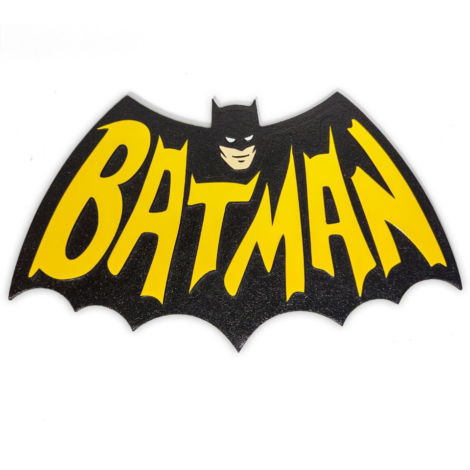 CNC-engraved wood Batman logo faithfully rendered in the bold 1960s TV-series style — a one-of-a-kind handmade piece, not a mass-printed poster.