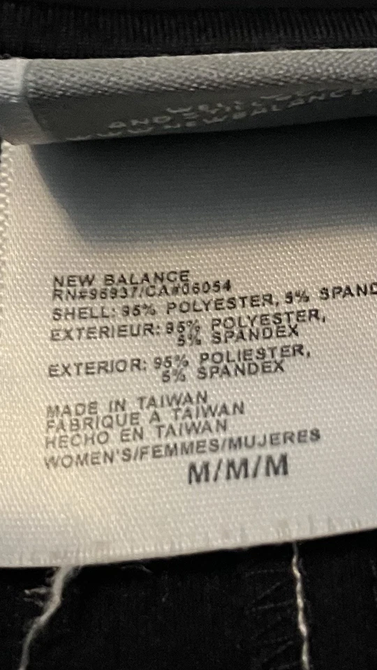 Prenda deportiva para correr New Balance negra blanca con cremallera manga larga para dama Foto 4 de 4