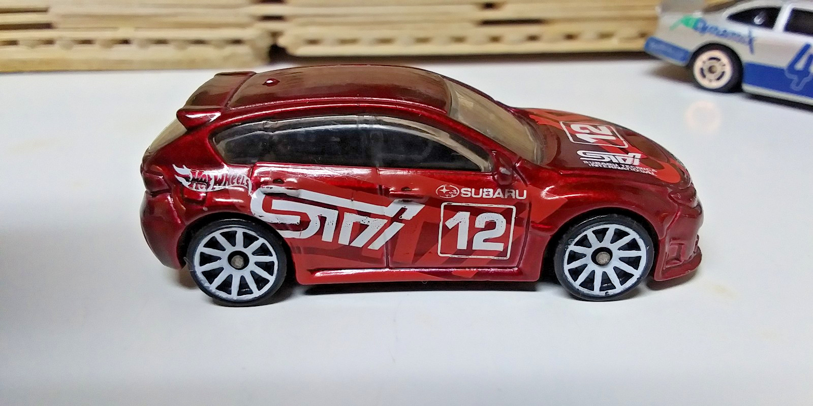 2012 Hot Wheels Red Subaru WRX STI Hatchback Mainline Carded Diecast Toy Car