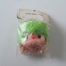 Wang's International 4 1/2" Doll Head with Green Yarn Hair Hands No. PDH6138