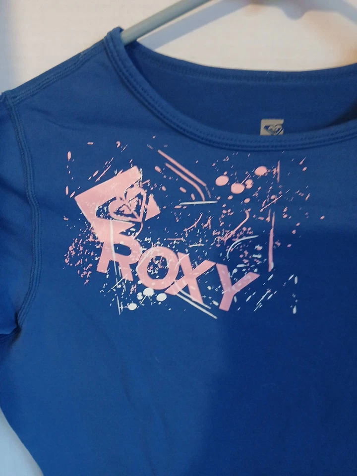 Camiseta Roxy Niñas Azul Con Rosa Salpicaduras Corazón Diseño Talla 4 Tecnología UV Foto 2 de 4