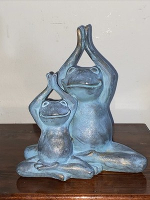 Two frogs in yoga lotus pose