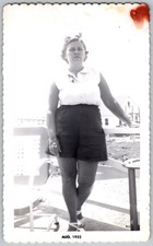 Vtg B&W Snapshot Woman in White Sleeveless Shirt Dark Shorts Deck Aug 1952