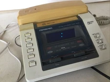 Soundesign Am/FM Electronic Clock Radio With Integrated Telephone. 