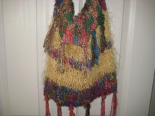 Handmade colorful handbag. Lined w attached closure Crocheted /knitted.