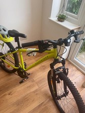 Rockrider 24in Kids Mountain Bike Yellow Front Suspension V-Brake Flat Bar