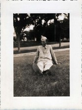 WW2 Photo of Soldier Sitting on Grass Smiling Outdoors