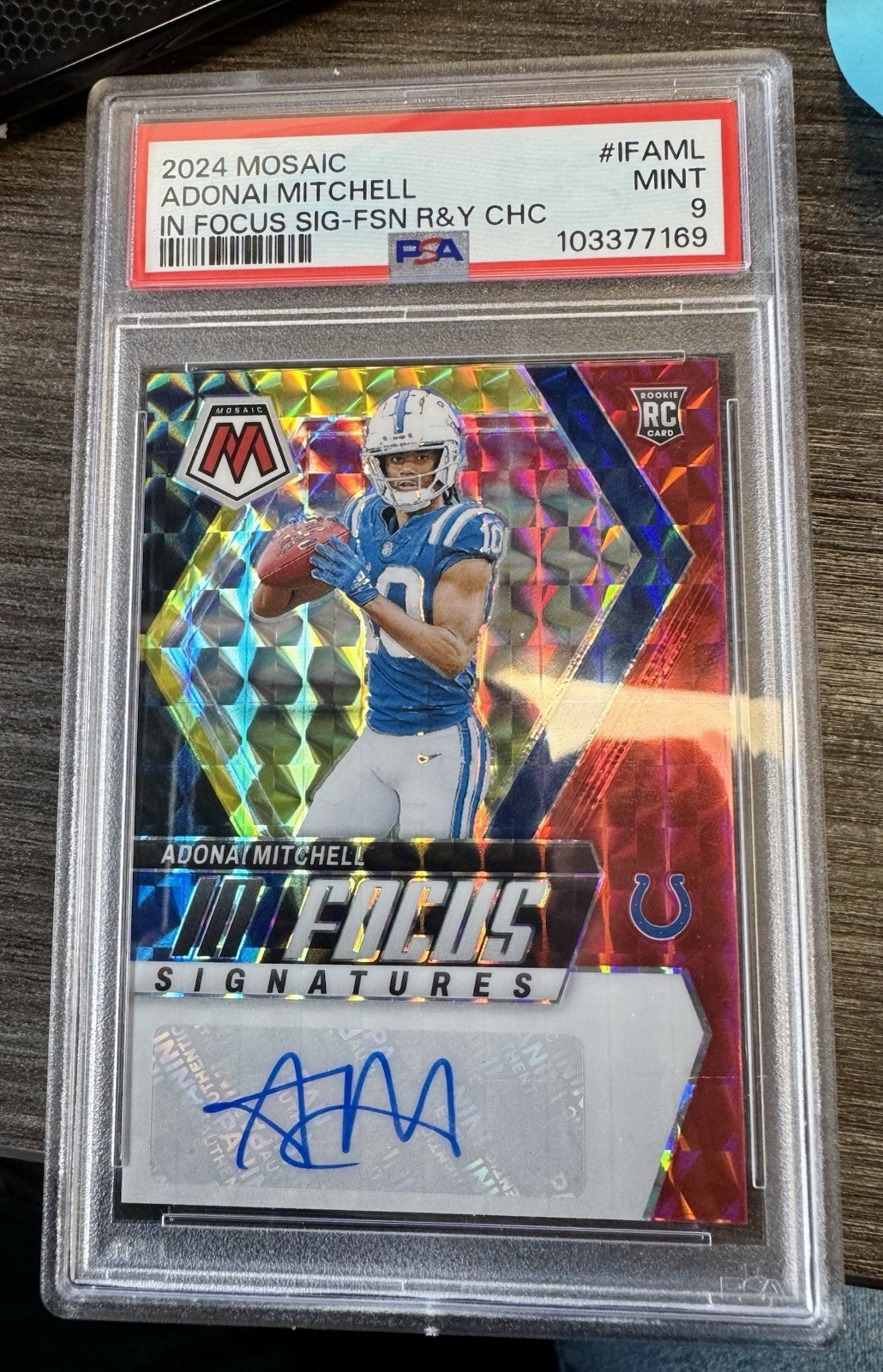 2024 Mosaic Adonai Mitchell Blue Prizm #/99 In Focus Signatures Auto RC Rookie