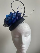 Navy and blue fascinator with loops, flower, quill and flowers