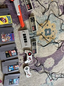 Original Nintendo, 6 controllers,duck hunt gun NES four score and five games.
