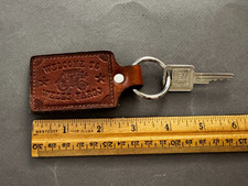 WELCOME TO WELLS FARGO LEATHER STAGECOACH KEYCHAIN FOB BADGE WITH GM KEY VTG
