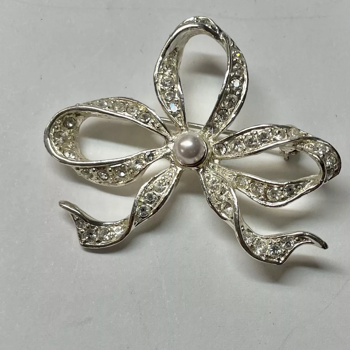 Roman 2024 bow brooch