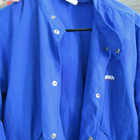 Blue vintage 90s Polo Sport Ralph Lauren jacket with white snap buttons, pointed collar, and small white “JREN” logo on chest.