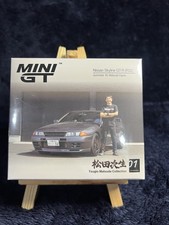 Mini GT 869 Nissan Skyline GT-R (R32) Nismo Gunmetal W/ Matsuda Figure
