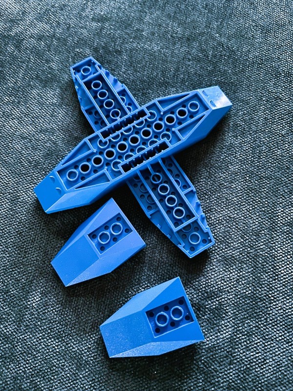 LEGO PLANE BASE PEICE IS ATTACHED TWO EXTRA PEICES BLUE