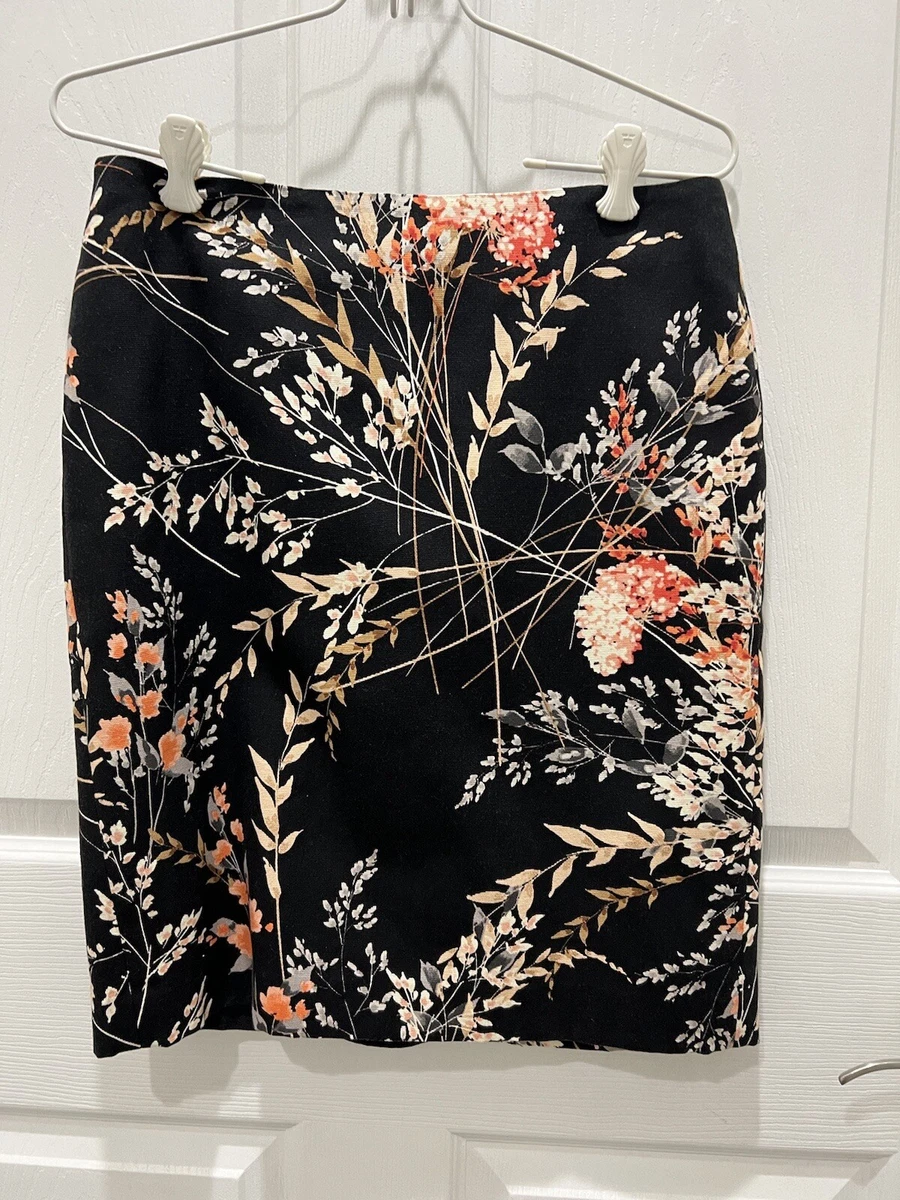 Mini-jupe plissée scintillante avec ceinture en noir - Boutique de Mode