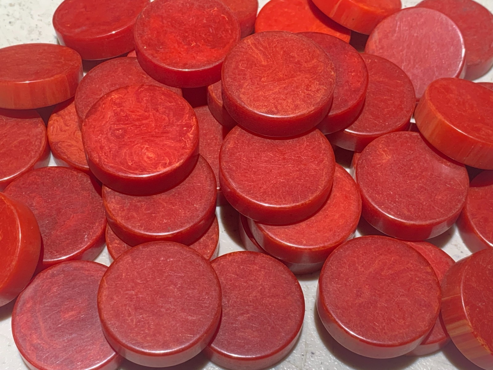 Vintage Marbled Bakelite Red Checkers or Backgammon.  30 mm by 9 mm.