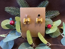 Festive Gold Polymer Clay Bow Earrings, Perfect For Christmas Parties.