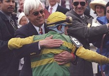 Jockey Gary Stevens trainer Bob Baffert hug each other at the 123r- Old Photo