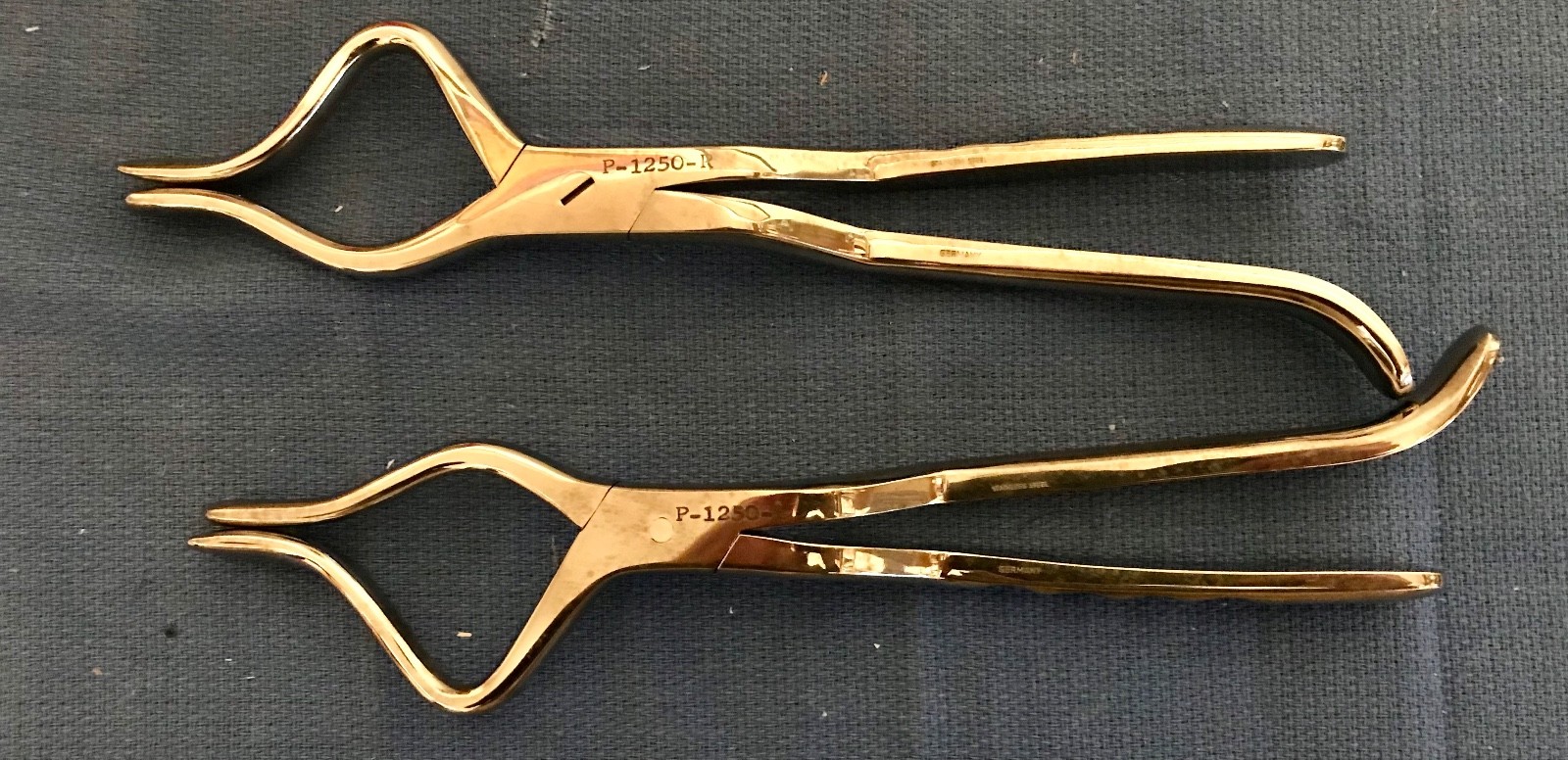 Padgett P-1250-R and P-1250-L Rowe maxillary disimpaction forceps. GC, guarantee