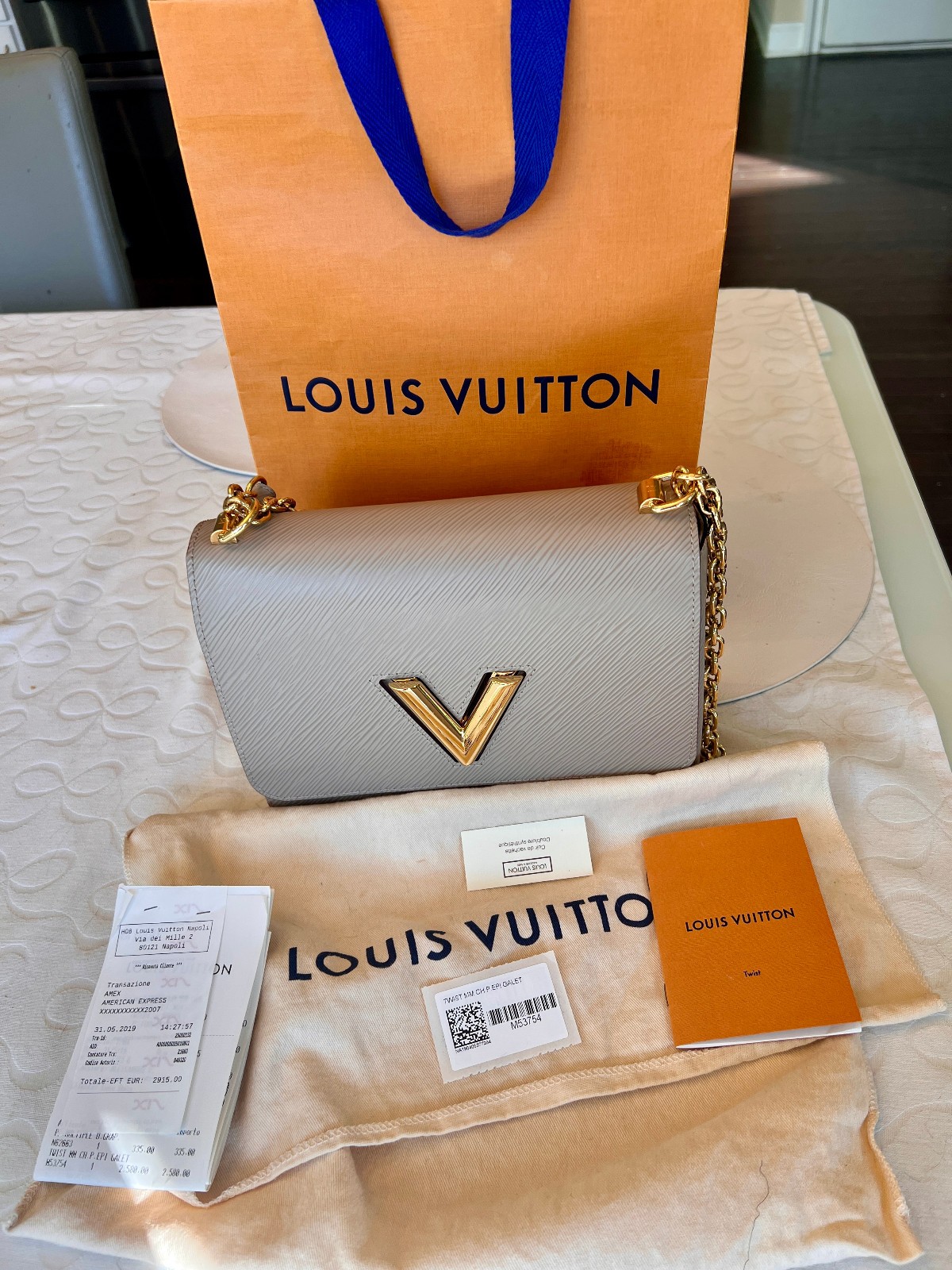 Authentic Louis Vuitton Epi Twist M53754 Grey. Rarely Used Excellent Cond.