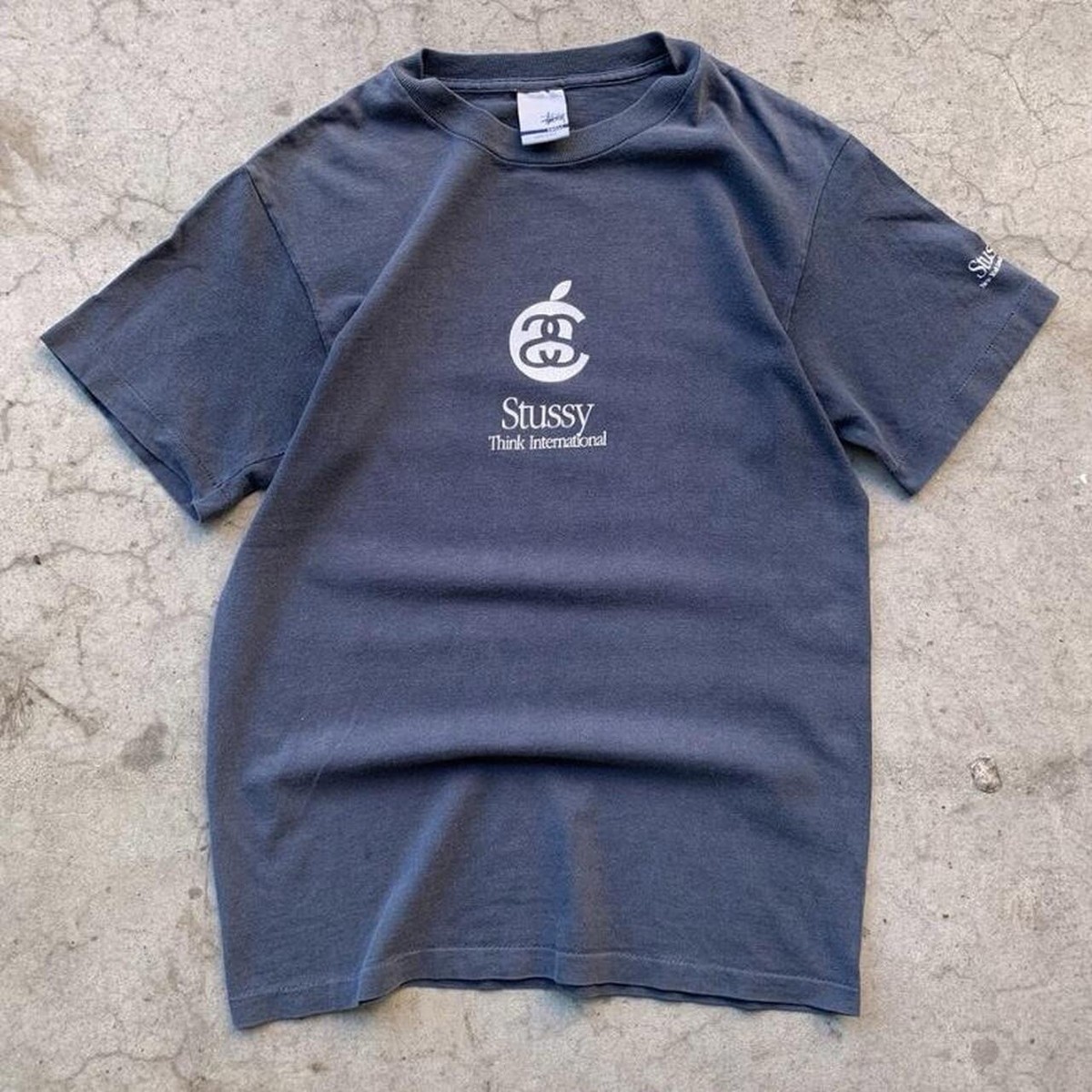S) 90's Stussy S4 “Think International” Apple Logo Parody S) 90's Stussy S4 “Think International” Apple Logo Parody