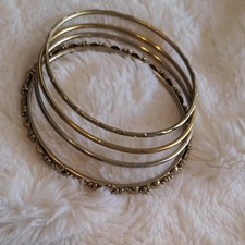 Gold Tone Metal Stackable Bangle Bracelet Set with Patterned Designs