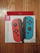 Nintendo Switch Joy Cons Neon Red (left) & Neon Blue (right)
