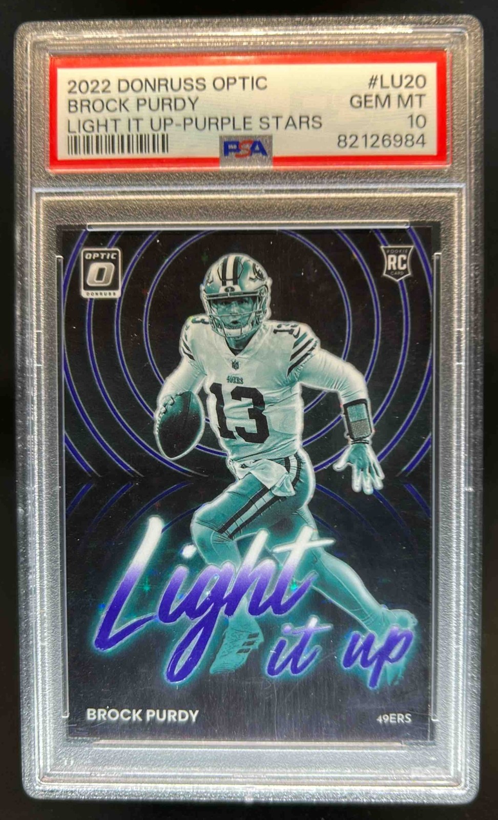 Brock Purdy Panini Donruss Optic Light It Up #LU20 Purple Stars