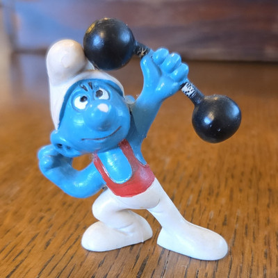 Die Schlümpfe Schlumpf Figur mit Hantel, blau/weiß/rot, Kunststoff, TV