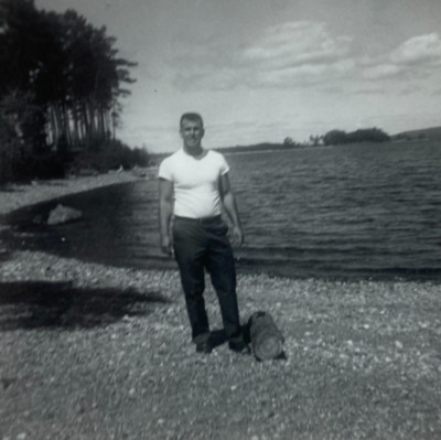 Handsome Man Standing By Log On Beach Of Lake B&W Photograph 3.5 x 3.5