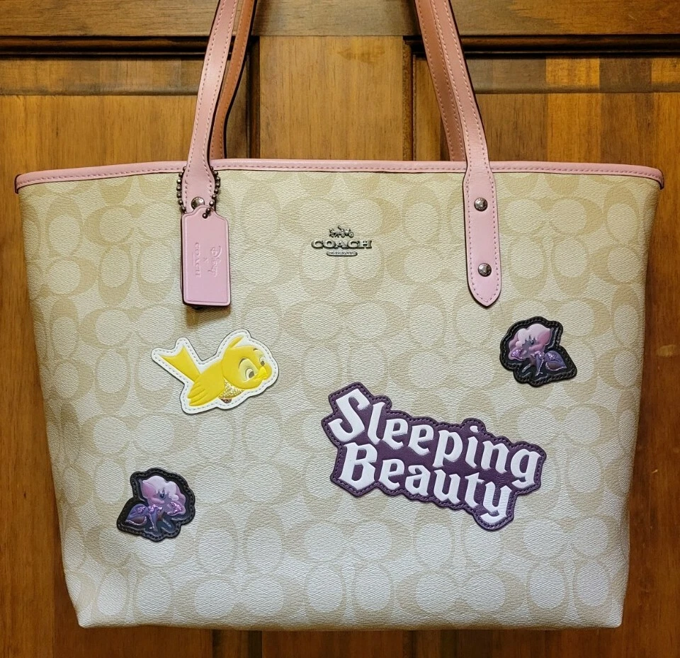 COACH X DISNEY SLEEPING BEAUTY CITY ZIP TOTE SIGNATURE COATED CANVAS F73359