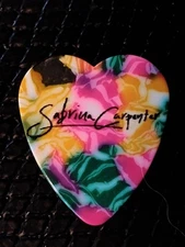 WONDERFUL SABRINA CARPENTER STAGE USED MULTI COLORED HEART GUITAR PICK FROM TOUR