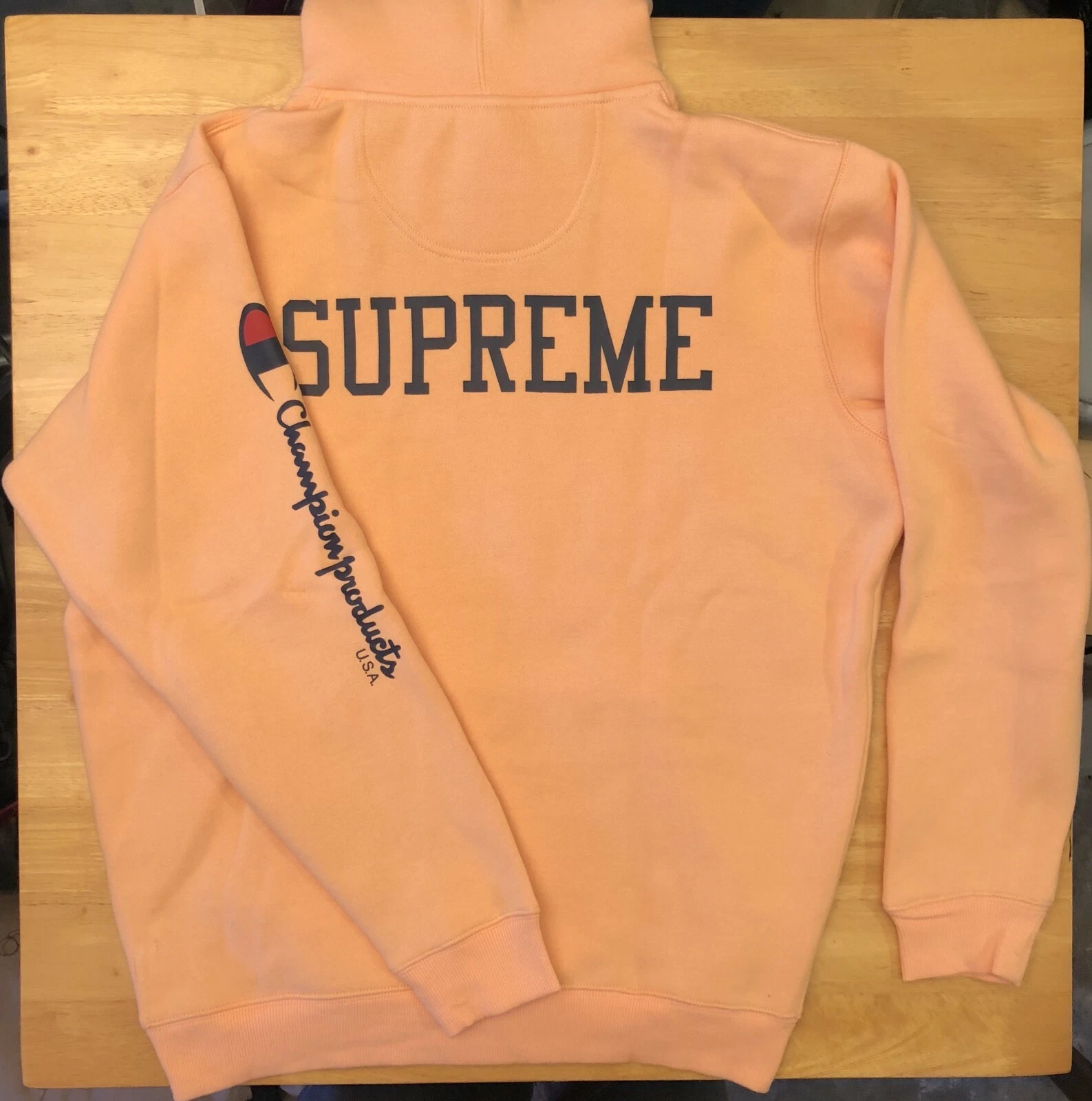 Sweat à capuche logo Champion & Supreme pêche orange taille XL   Livré le jour même