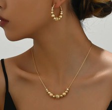Pierced gold chain and frosted bead necklace and hoop earring set