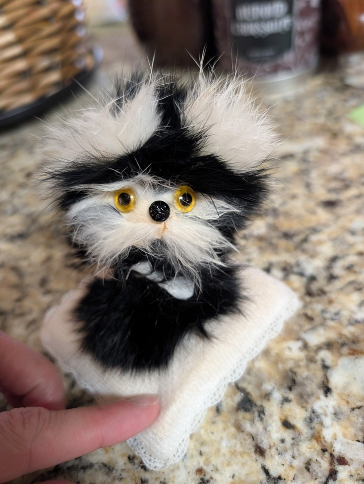 A fuzzy gonk-style fur figurine straight out of a 60s/70s novelty shop — pure kitsch charm.
