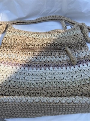 The Sak Crochet earth tone purse zipper closure outside pocket lined inside
