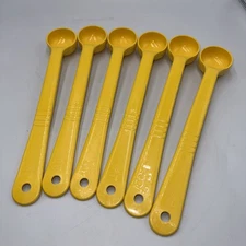 Carlisle  1 Oz. Yellow Long Handle Portion Spoon