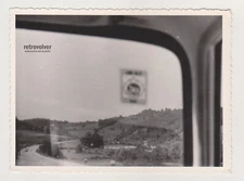 Awkward Shot Landscape Captured Through the Backseat Window of Car Snapshot