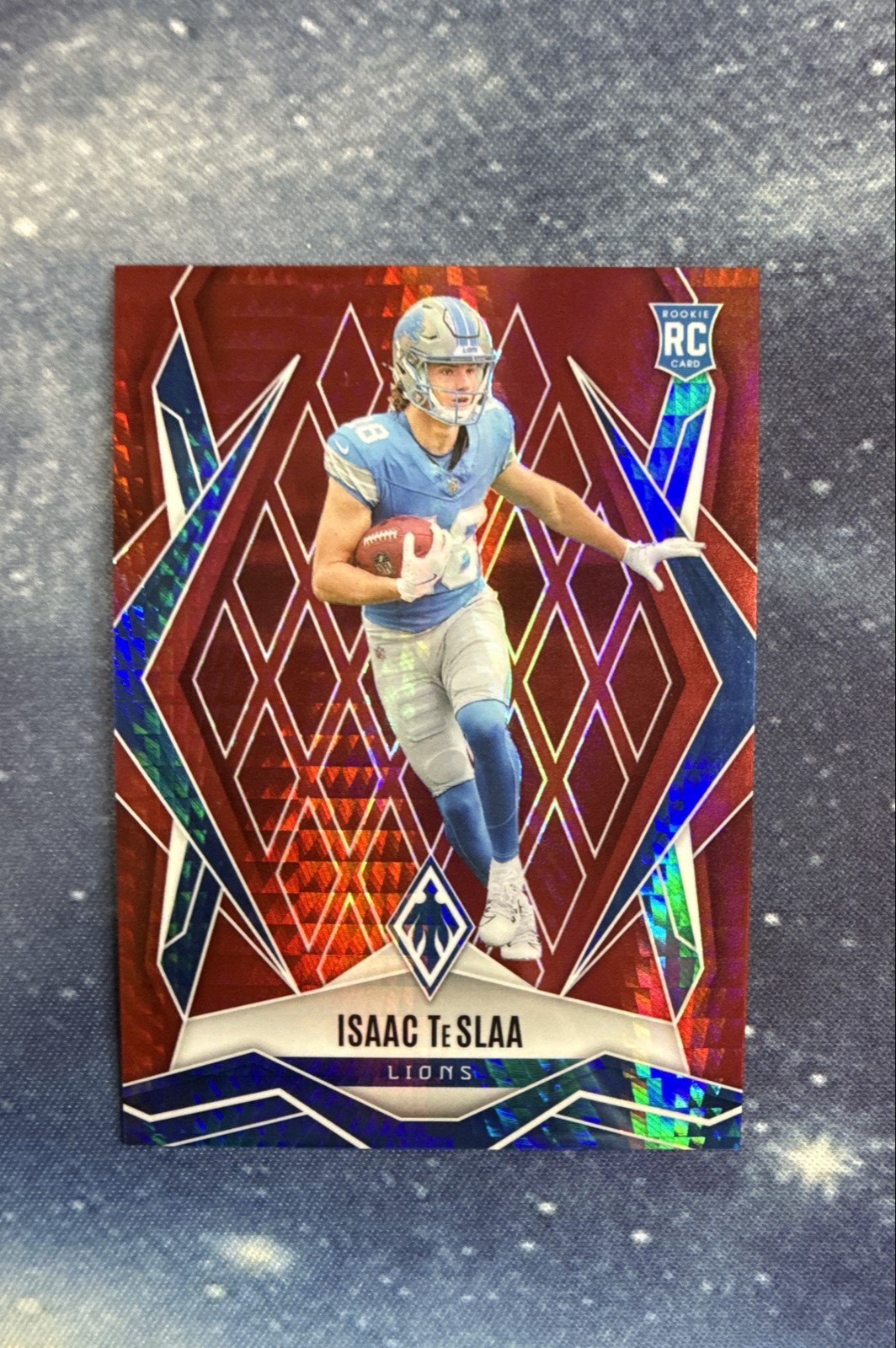 2025 Panini Phoenix - Rookies Isaac Teslaa #189 Red Hyper /399 (RC)