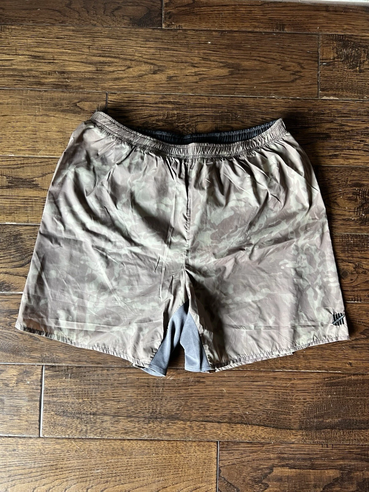 Short de course homme invaincu   Camouflage   Medium   Supreme
