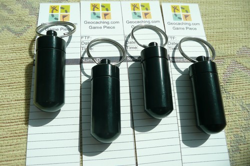geocache containers, 4x black bison tubes with Toughprint log roll