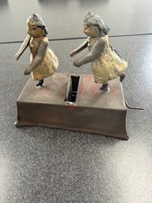 ANTIQUE GERMAN PENNY TOY TIN WIND TWO GIRLS DANCING TWIRLING hand painted