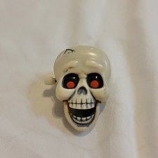 Cráneo esqueleto vintage Hallmark 1985 - ojos rojos - prendedor de cuerda - ¡Funciona!