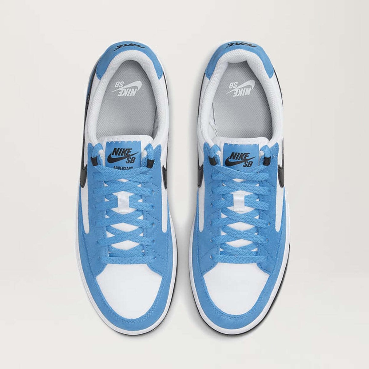 nike sb adversary trainers in cream and blue