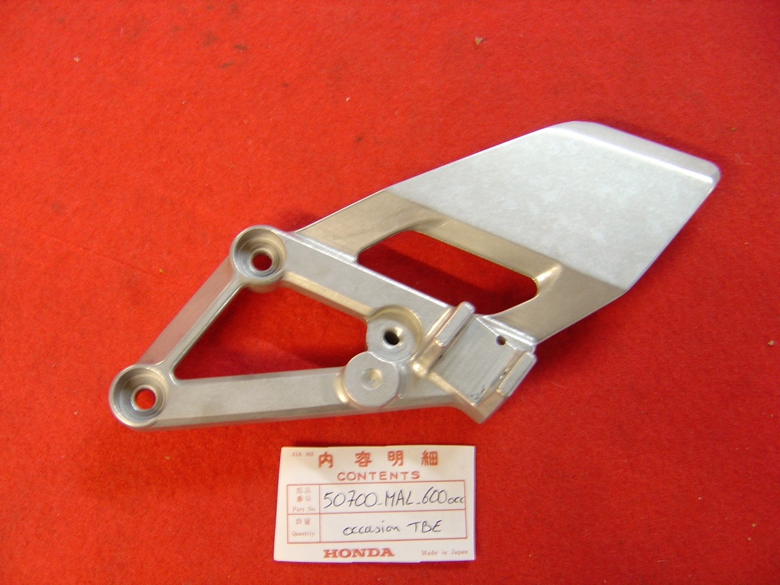 Platine repose pied AV gauche CBR600 95/98 en aluminium d'origine en très bon état