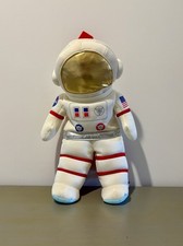 14" soft plush astronaut Backpack designed with a NASA emblem and US flag patch
