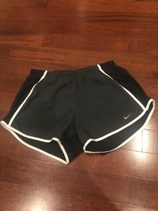 white nike shorts with black trim